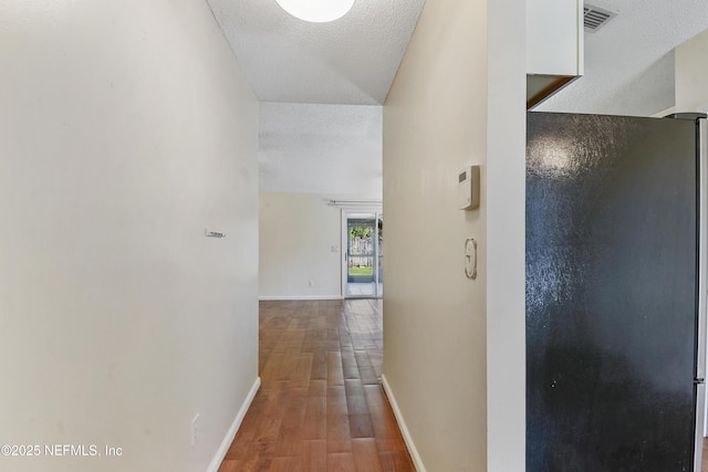 726 Calico Jack Way, Green Cove Springs, FL 32043 - hall with wood finished floors, baseboards, and a textured ceiling