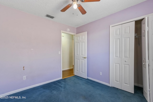 726 Calico Jack Way, Green Cove Springs, FL 32043 - unfurnished bedroom with a textured ceiling, dark colored carpet, a closet, baseboards, and ceiling fan
