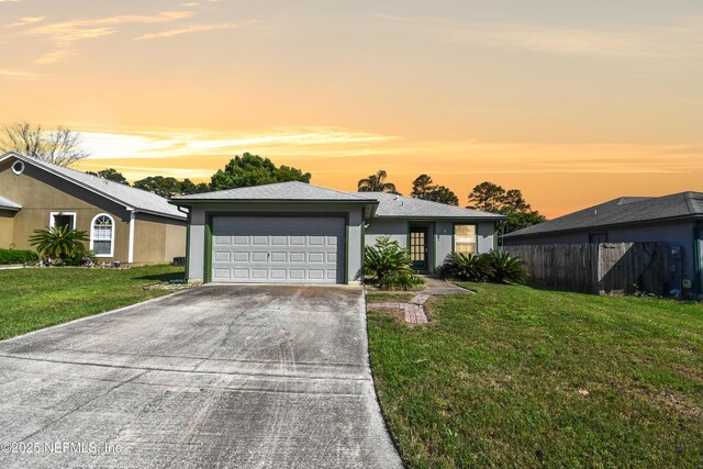 726 Calico Jack Way, Green Cove Springs, FL 32043 - view of front facade featuring a garage, driveway, and stucco siding