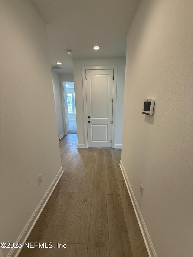 38 Mulberry Rd, Palm Coast, FL 32164 - hallway featuring wood finished floors, baseboards, and recessed lighting