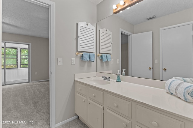347 Greencastle Rd Unit 46, Jacksonville, FL 32225 - bathroom with a textured ceiling, baseboards, and vanity