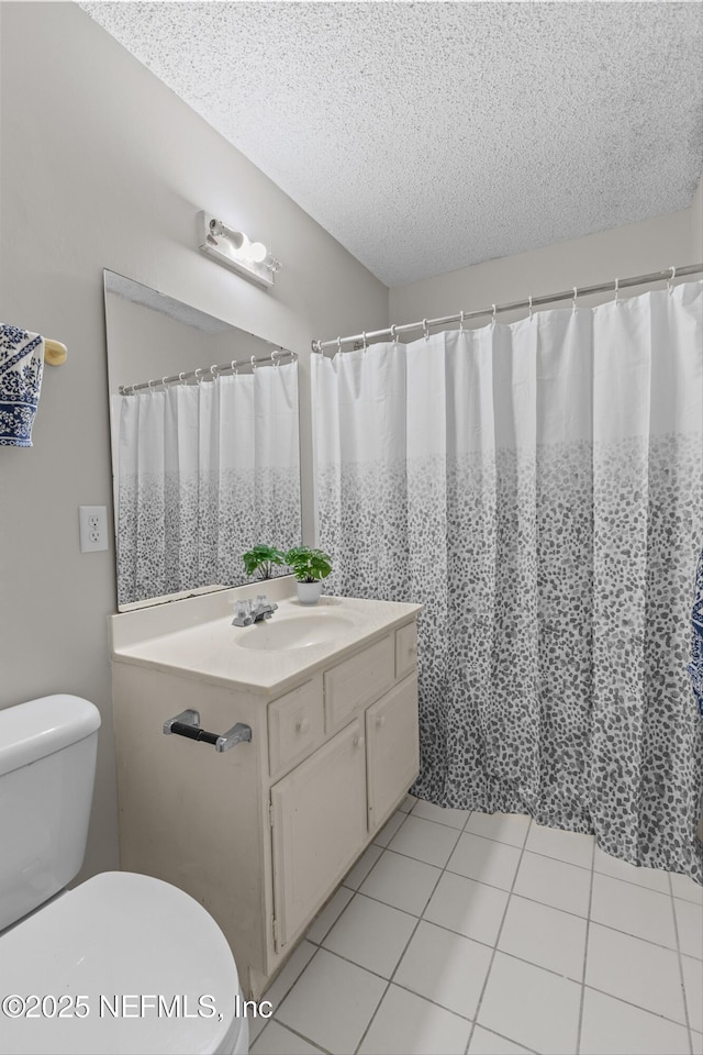 347 Greencastle Rd Unit 46, Jacksonville, FL 32225 - bathroom featuring a textured ceiling, toilet, vanity, and tile patterned flooring