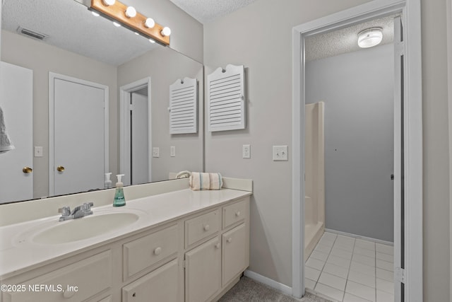 347 Greencastle Rd Unit 46, Jacksonville, FL 32225 - full bathroom featuring a textured ceiling, vanity, baseboards, and tile patterned floors