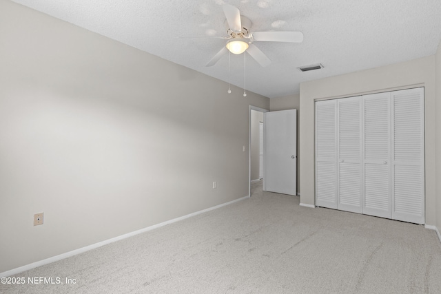 347 Greencastle Rd Unit 46, Jacksonville, FL 32225 - unfurnished bedroom featuring carpet flooring, baseboards, a closet, and a textured ceiling