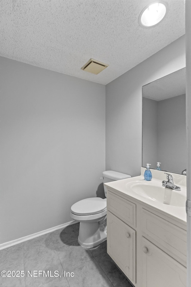 347 Greencastle Rd Unit 46, Jacksonville, FL 32225 - bathroom featuring a textured ceiling, toilet, vanity, and tile patterned flooring