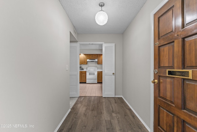 347 Greencastle Rd Unit 46, Jacksonville, FL 32225 - corridor with baseboards, dark wood-style floors, and a textured ceiling