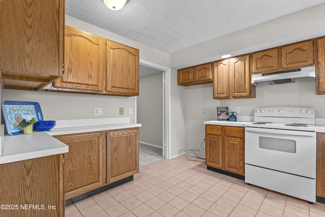 347 Greencastle Rd Unit 46, Jacksonville, FL 32225 - kitchen with under cabinet range hood, white range with electric cooktop, light countertops, brown cabinets, and a textured ceiling