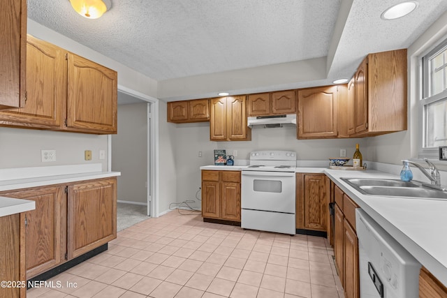 347 Greencastle Rd Unit 46, Jacksonville, FL 32225 - kitchen featuring white appliances, a sink, under cabinet range hood, brown cabinetry, and a textured ceiling