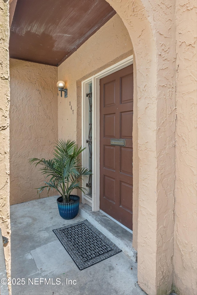 347 Greencastle Rd Unit 46, Jacksonville, FL 32225 - doorway to property featuring stucco siding