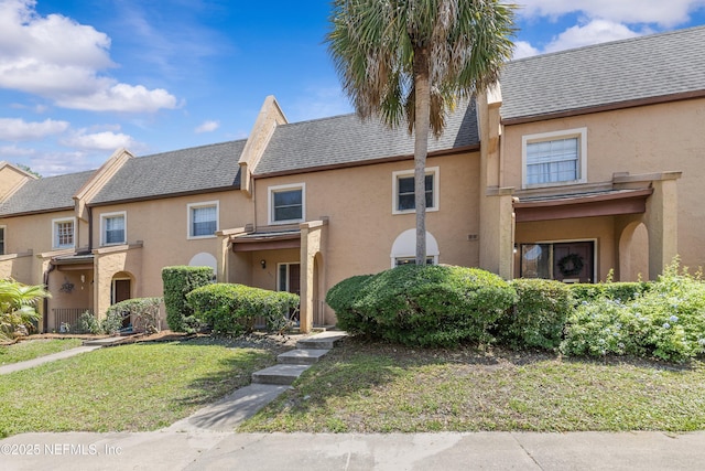 347 Greencastle Rd Unit 46, Jacksonville, FL 32225 - townhome / multi-family property with stucco siding and a front lawn