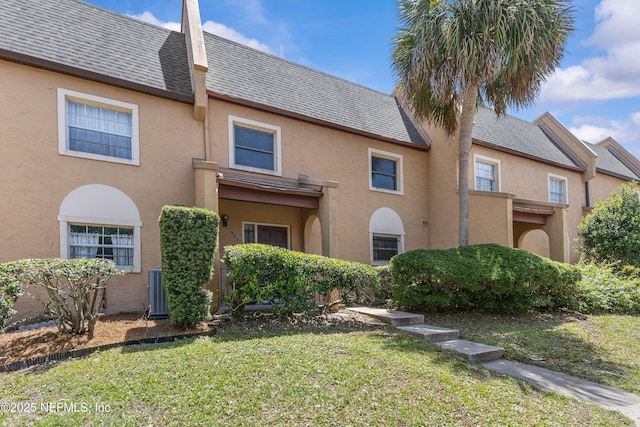 347 Greencastle Rd Unit 46, Jacksonville, FL 32225 - view of front of home with stucco siding and a front yard