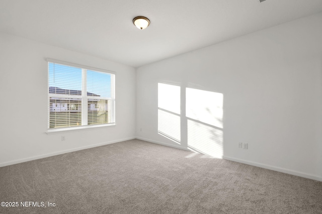 477 Cherry Elm Dr, Saint Augustine, FL 32092 - unfurnished room featuring carpet flooring, baseboards, and vaulted ceiling