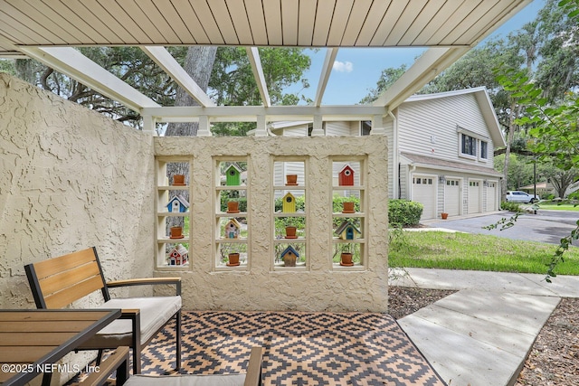 303 Vista Lagoon Ct Unit C-3, Ponte Vedra Beach, FL 32082 - view of patio / terrace with an attached garage and driveway