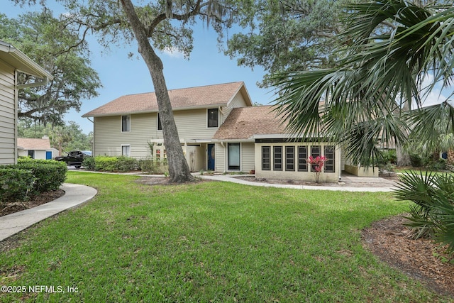 303 Vista Lagoon Ct Unit C-3, Ponte Vedra Beach, FL 32082 - rear view of property featuring a lawn and roof with shingles
