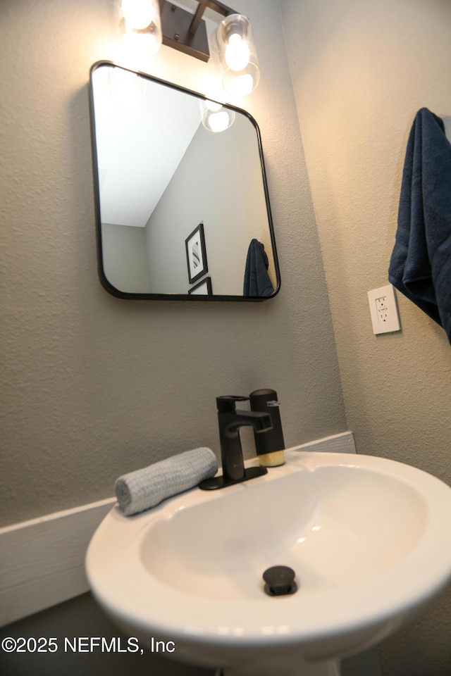 1207 Neva St, Jacksonville, FL 32205 - bathroom featuring a sink and a textured wall