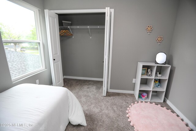 1207 Neva St, Jacksonville, FL 32205 - carpeted bedroom with a closet and baseboards