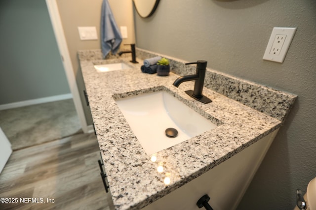 1207 Neva St, Jacksonville, FL 32205 - bathroom with double vanity, toilet, and wood finished floors