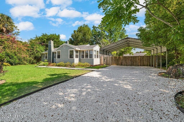 1724 Orlando Cir N, Jacksonville, FL 32207 - ranch-style home featuring gravel driveway, a detached carport, and a chimney