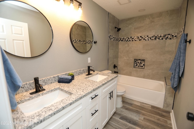 1205 Neva St, Jacksonville, FL 32205 - full bath featuring wood finished floors, double vanity, shower / washtub combination, and toilet