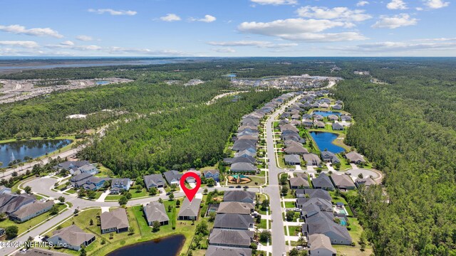 61 Sunrise Vista Way, Ponte Vedra, FL 32081 - aerial overview of property's location with a forest, nearby suburban area, and a large body of water