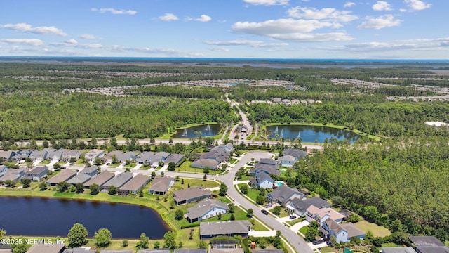 61 Sunrise Vista Way, Ponte Vedra, FL 32081 - aerial view of property and surrounding area with a heavily wooded area, a nearby body of water, and nearby suburban area