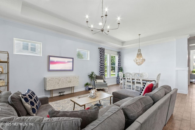 61 Sunrise Vista Way, Ponte Vedra, FL 32081 - living area featuring a chandelier, a tray ceiling, and wood finished floors