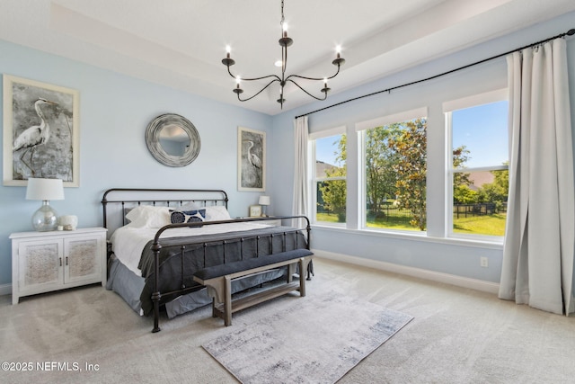 61 Sunrise Vista Way, Ponte Vedra, FL 32081 - bedroom with carpet, a chandelier, baseboards, and a tray ceiling