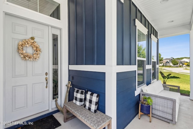 61 Sunrise Vista Way, Ponte Vedra, FL 32081 - view of exterior entry with a porch and board and batten siding