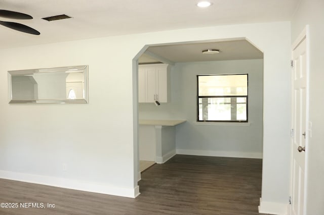 2242 Lake Lucina Dr, Jacksonville, FL 32211 - corridor featuring baseboards, arched walkways, dark wood finished floors, and recessed lighting