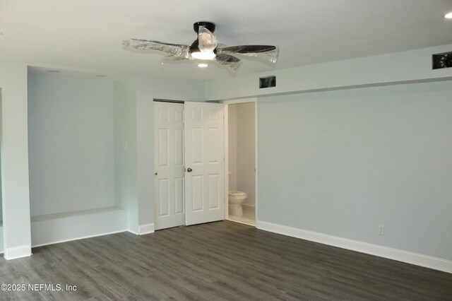 2242 Lake Lucina Dr, Jacksonville, FL 32211 - unfurnished bedroom with dark wood-style floors, baseboards, a closet, and ceiling fan