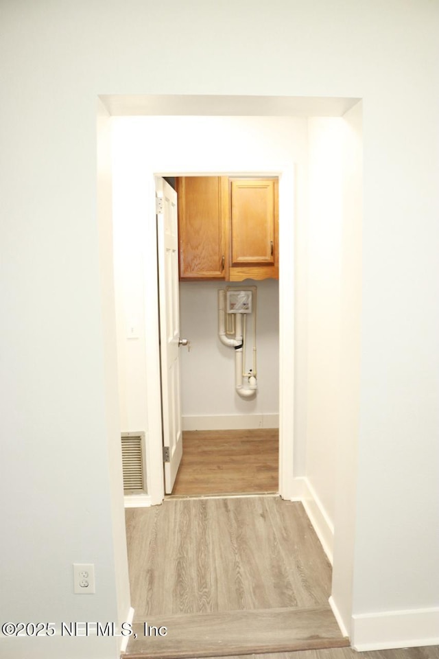 2242 Lake Lucina Dr, Jacksonville, FL 32211 - hall featuring light wood finished floors and baseboards