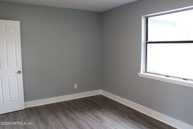 2242 Lake Lucina Dr, Jacksonville, FL 32211 - empty room featuring dark wood-type flooring and baseboards