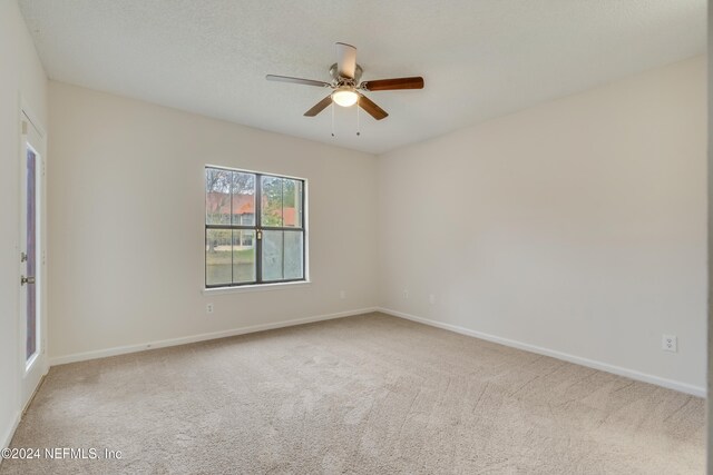 1701 Wood Hill Pl Unit 1701, Jacksonville, FL 32256 - carpeted spare room with a ceiling fan and baseboards