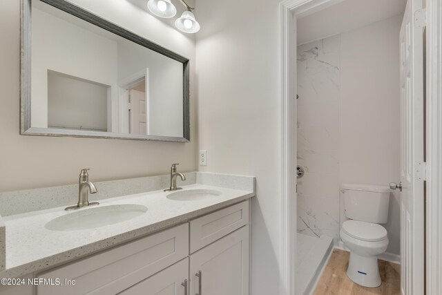 1701 Wood Hill Pl Unit 1701, Jacksonville, FL 32256 - bathroom with toilet, double vanity, a shower, and wood finished floors