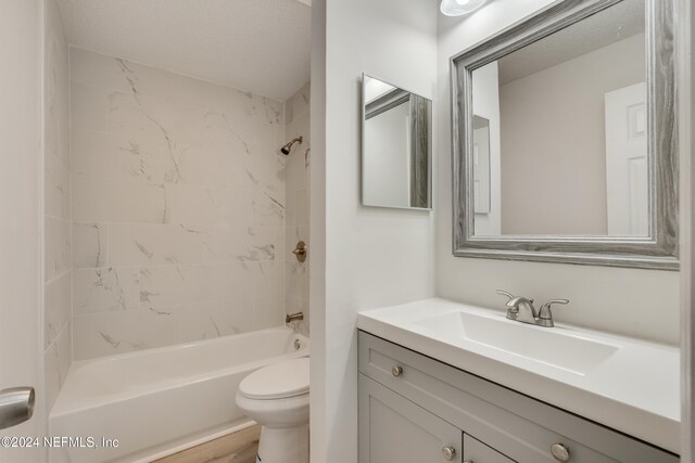 1701 Wood Hill Pl Unit 1701, Jacksonville, FL 32256 - full bathroom with toilet, shower / tub combination, vanity, and a textured ceiling