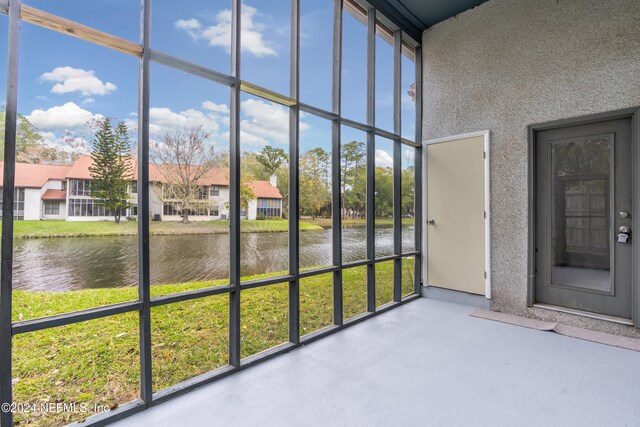 1701 Wood Hill Pl Unit 1701, Jacksonville, FL 32256 - unfurnished sunroom featuring a water view