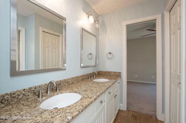 full bathroom featuring double vanity and tile patterned flooring