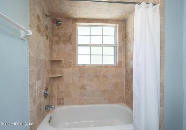 bathroom with shower / bathtub combination with curtain