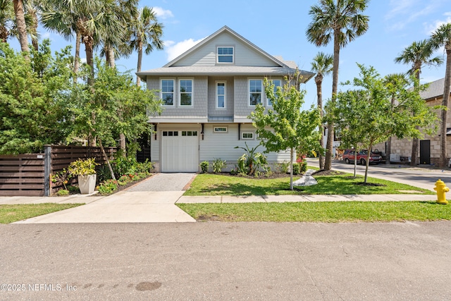 520 E Coast Dr, Atlantic Beach, FL 32233 - view of property with driveway, fence, and an attached garage