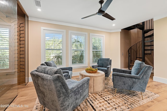 520 E Coast Dr, Atlantic Beach, FL 32233 - living room with ornamental molding, baseboards, ceiling fan, stairway, and light wood-style floors