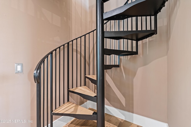 520 E Coast Dr, Atlantic Beach, FL 32233 - stairs featuring wood finished floors and baseboards