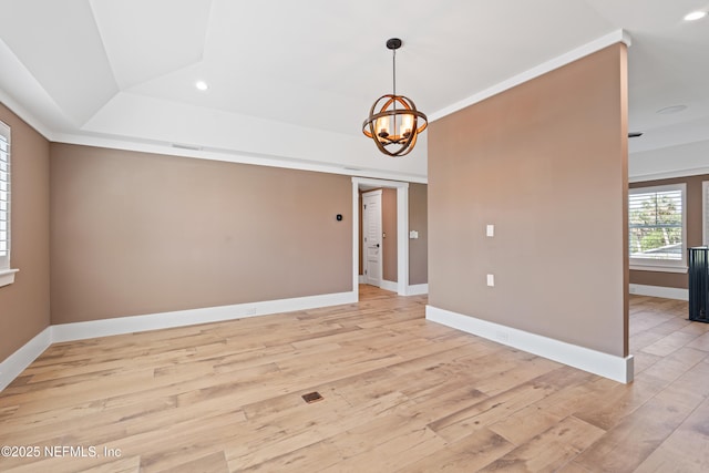 520 E Coast Dr, Atlantic Beach, FL 32233 - empty room with recessed lighting, a chandelier, light wood-type flooring, baseboards, and a tray ceiling