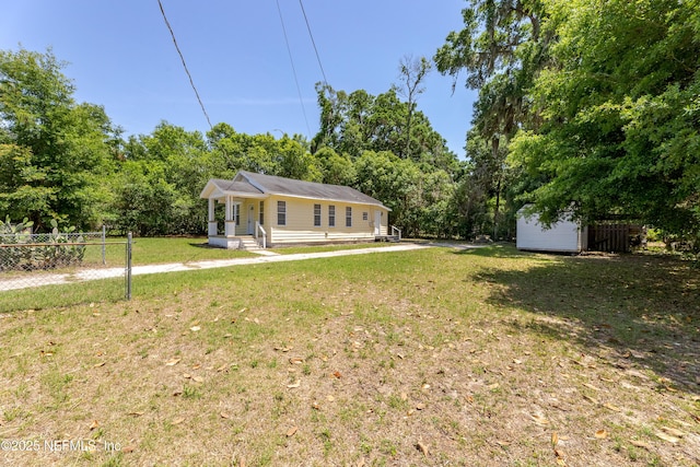 4242 Turton Ave, Jacksonville, FL 32208 - ranch-style house with a storage unit and an outbuilding