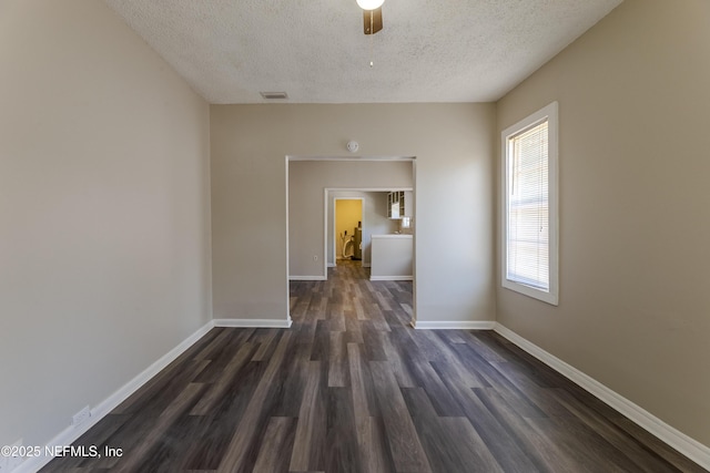 4242 Turton Ave, Jacksonville, FL 32208 - unfurnished room with a textured ceiling, dark wood finished floors, baseboards, and ceiling fan