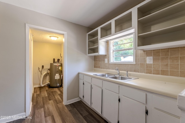 4242 Turton Ave, Jacksonville, FL 32208 - kitchen featuring electric water heater, open shelves, a sink, decorative backsplash, and dark wood-style flooring