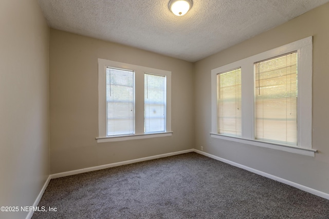 4242 Turton Ave, Jacksonville, FL 32208 - empty room with dark carpet, a textured ceiling, and baseboards