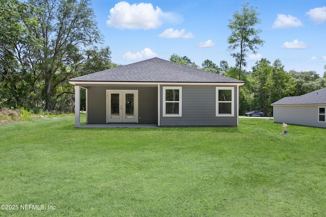 323 Rustic Rd, Satsuma, FL 32189 - back of house with french doors, a yard, roof with shingles, and a patio area