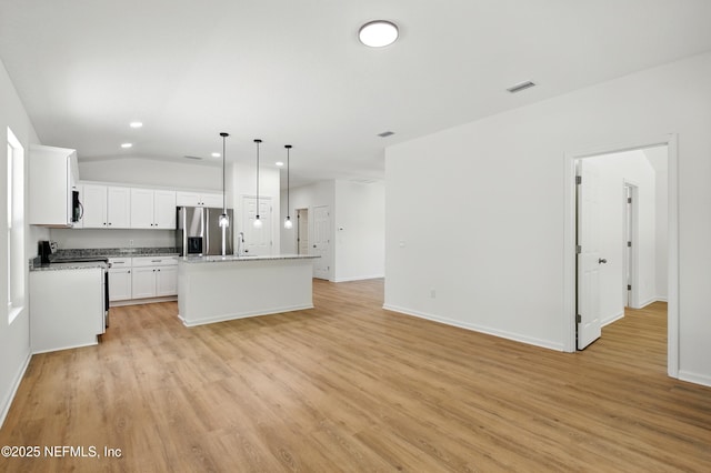 323 Rustic Rd, Satsuma, FL 32189 - kitchen with stainless steel refrigerator with ice dispenser, recessed lighting, light wood-style flooring, decorative light fixtures, and open floor plan