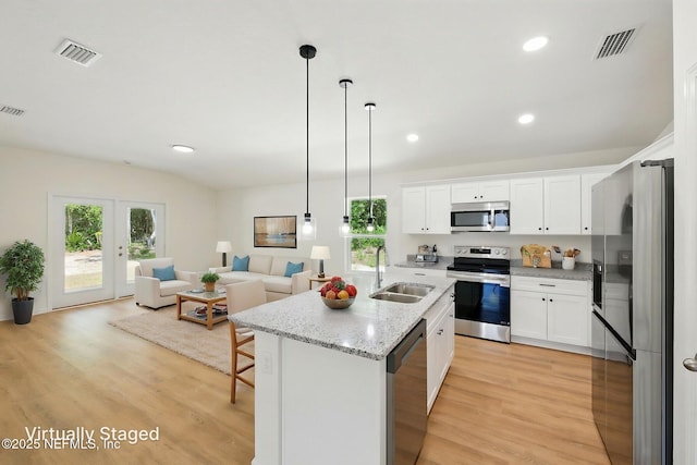 323 Rustic Rd, Satsuma, FL 32189 - kitchen with stainless steel appliances, a sink, open floor plan, healthy amount of natural light, and recessed lighting