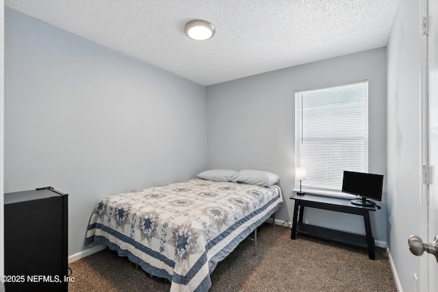 1961 Spring Drive Rd, Jacksonville, FL 32209 - carpeted bedroom featuring baseboards and a textured ceiling